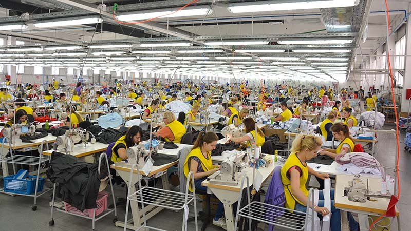 A clean and organized apparel manufacturing factory floor