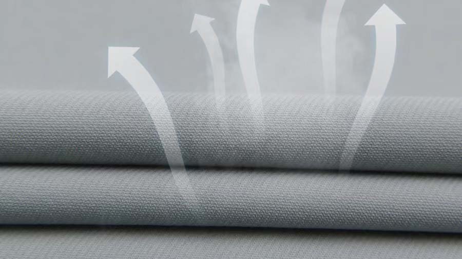 Polyester-Spandex Fabric Blend Rolls of polyester-spandex blend fabric in a textile factory