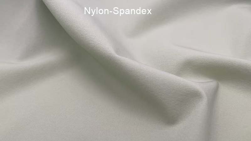 Premium Nylon Golf Shorts for Hot Weather A pair of high-end, smooth-textured nylon golf shorts laid out neatly