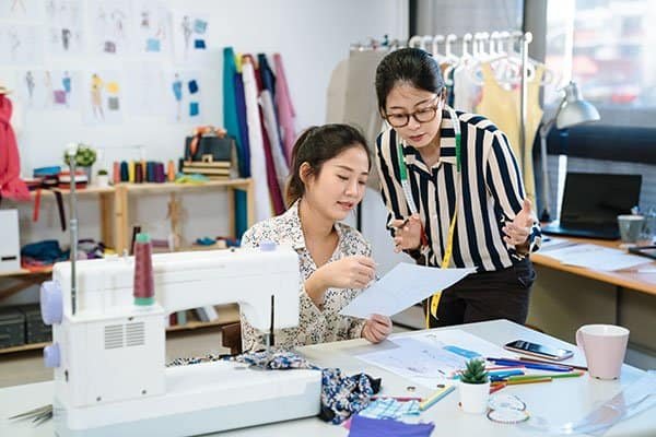 two,asian,chinese,women,meeting,in,fashion,design,studio.,female